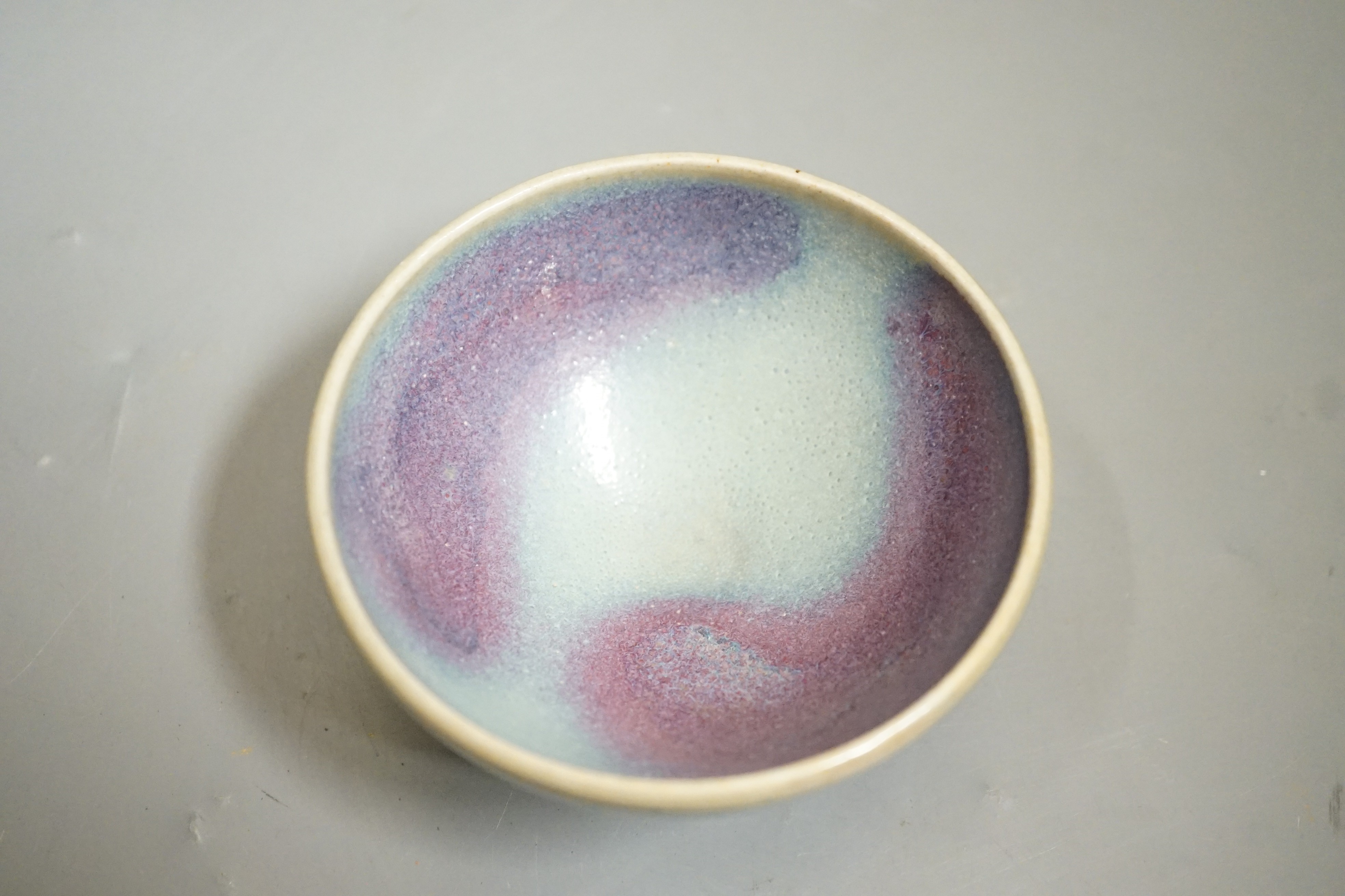 A Jun type purple splashed bowl, 9.5 cms diameter